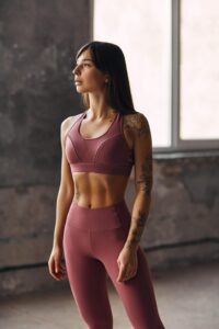 An image of a Dancer warming up in leggings